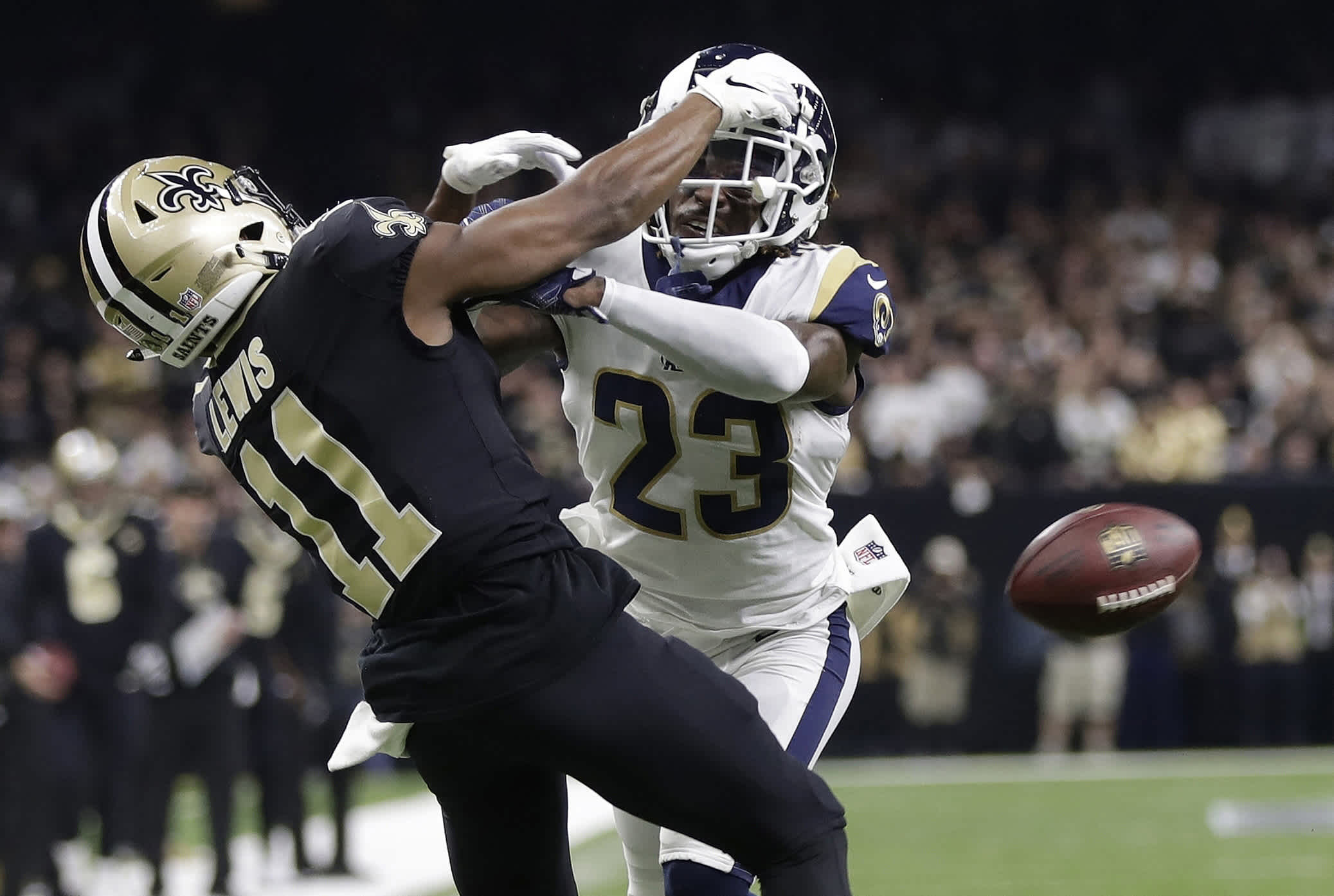 FILE - In this Jan. 20, 2019, file photo, Los Angeles Rams' Nickell Robey-Coleman breaks up a pass intended for New Orleans Saints' Tommylee Lewis during the second half of the NFL football NFC championship game in New Orleans. The non-call on the play involving Rams Nickell Robey-Coleman in the NFC championship game cost the Saints a trip to the Super Bowl. (Or, at least that's how they see it in New Orleans) After taking tons of flak, then admitting the call was wrong, but doing nothing to alter the outcome of the game, the NFL rule-makers met a few months later and declared pass interference would now be reviewable.(AP Photo/Gerald Herbert, File)