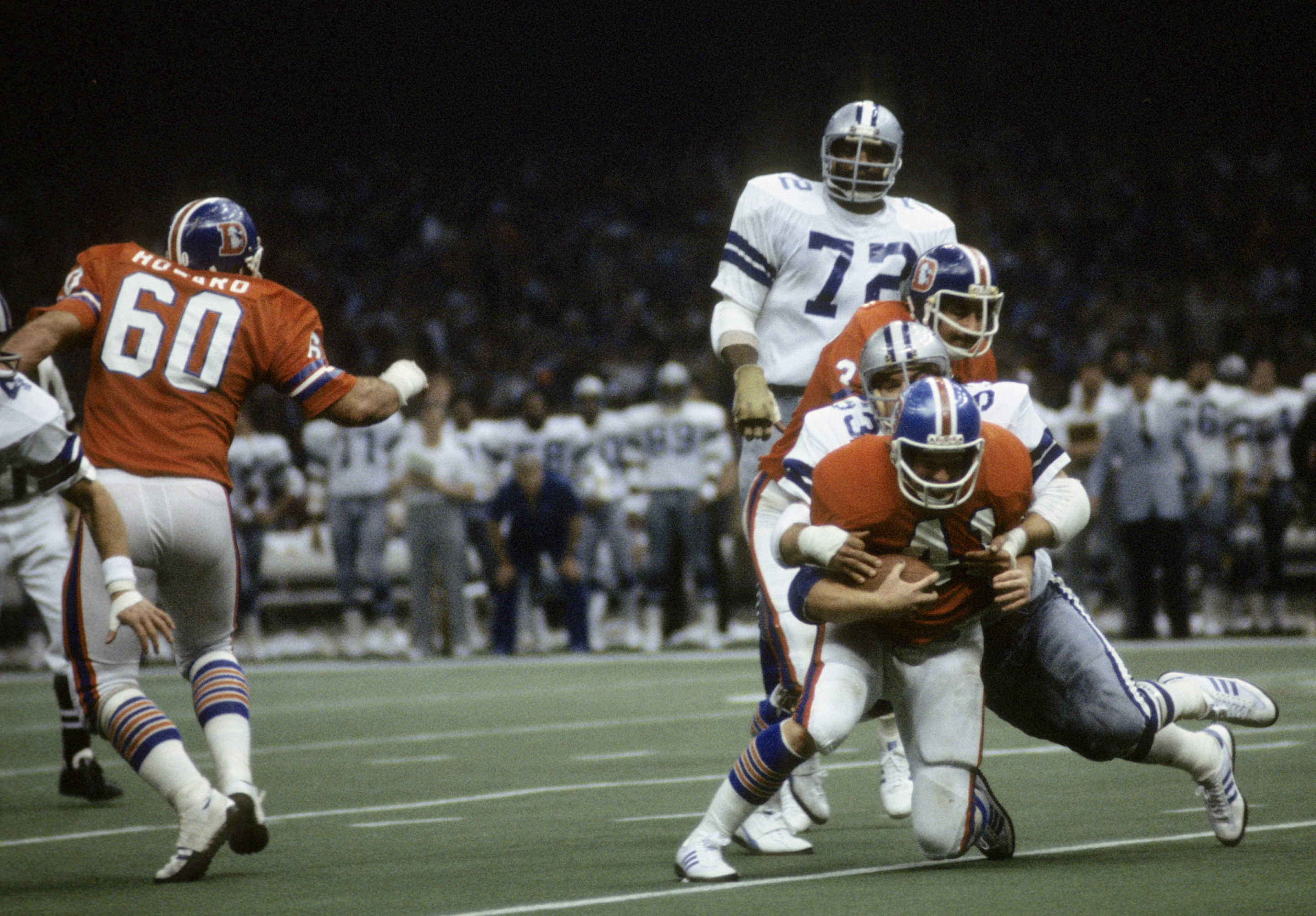 The Dallas Cowboys defense swarms Denver Broncos quarterback Craig Morton (11) during Super Bowl XII, a 27-10 Cowboys victory on January 15, 1978, at the Louisiana Superdome in New Orleans, Louisiana. (Photo by Nate Fine/Getty Images) *** Local Caption ***