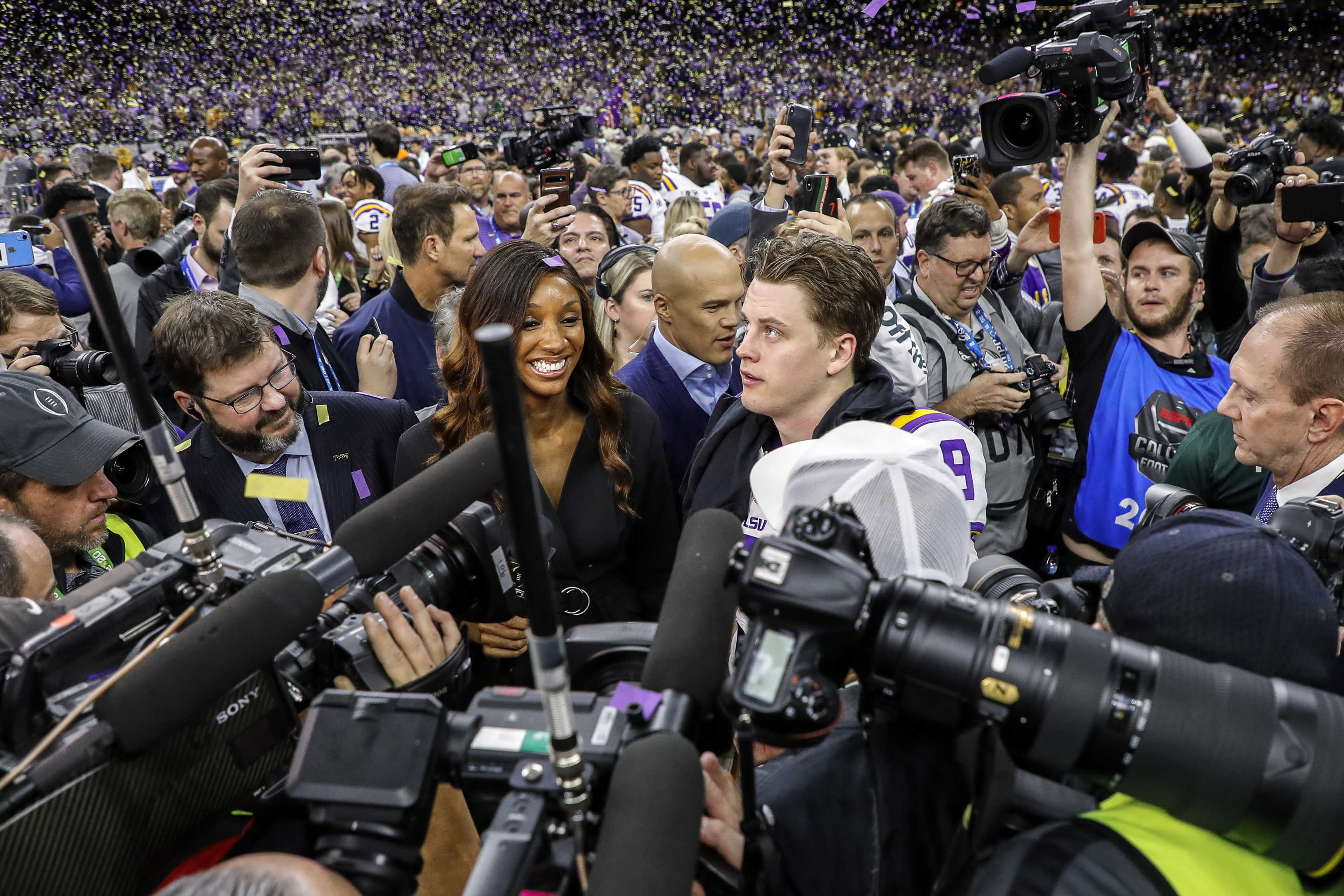 NEW ORLEANS, LA - JANUARY 13: ESPN Reporter Maria Taylor interview Quarterback Joe Burrow #9 of the LSU Tigers after the College Football Playoff National Championship game against the Clemson Tigers at the Mercedes-Benz Superdome on January 13, 2020 in New Orleans, Louisiana. LSU defeated Clemson 42 to 25. (Photo by Don Juan Moore/Getty Images)