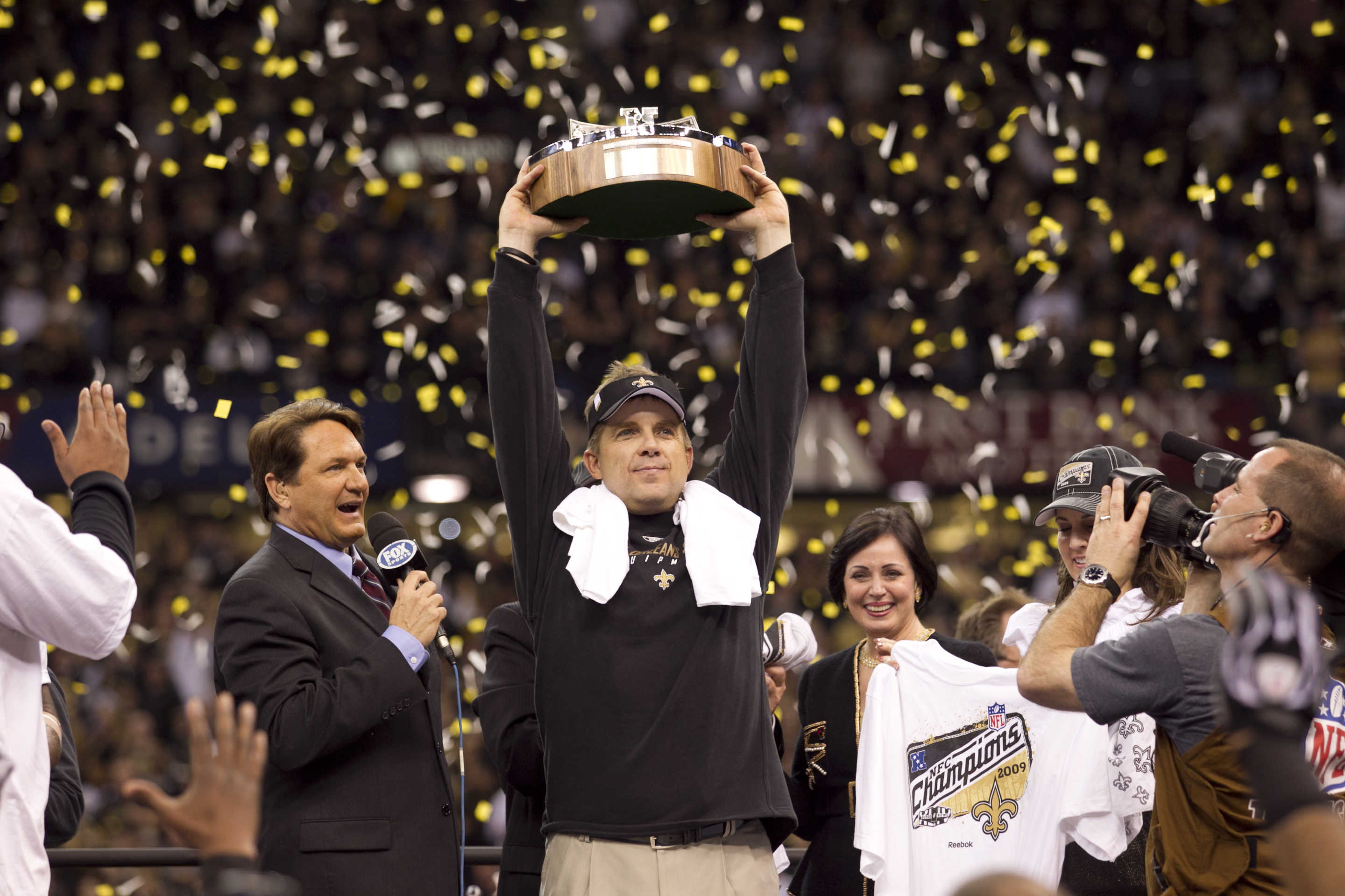 NEW ORLEANS - JANUARY 24: Head Coach Sean Payton of the New Orleans Saints celebrates holding up the George Halas NFC Championship trophy after their win against the Minnesota Vikings NFC Championship Game at the Louisiana Superdome on January 24, 2010 in New Orleans, Louisiana. The Saints won 31-28 in overtime to advance to the Super Bowl for the first time. (Photo by Tom Hauck/Getty Images)