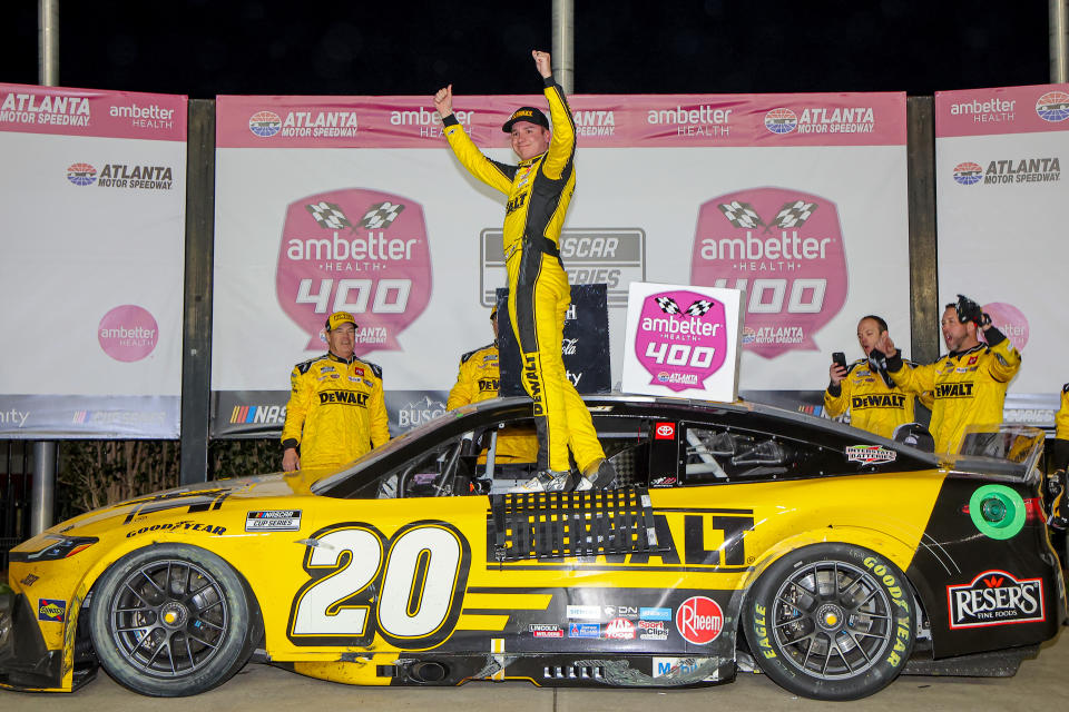 HAMPTON, GEORGIA - FEBRUARY 23: Christopher Bell, driver of the #20 DEWALT Toyota, celebrates in victory lane after winning the NASCAR Cup Series Ambetter Health 400 at Atlanta Motor Speedway on February 23, 2025 in Hampton, Georgia. (Photo by Jonathan Bachman/Getty Images)