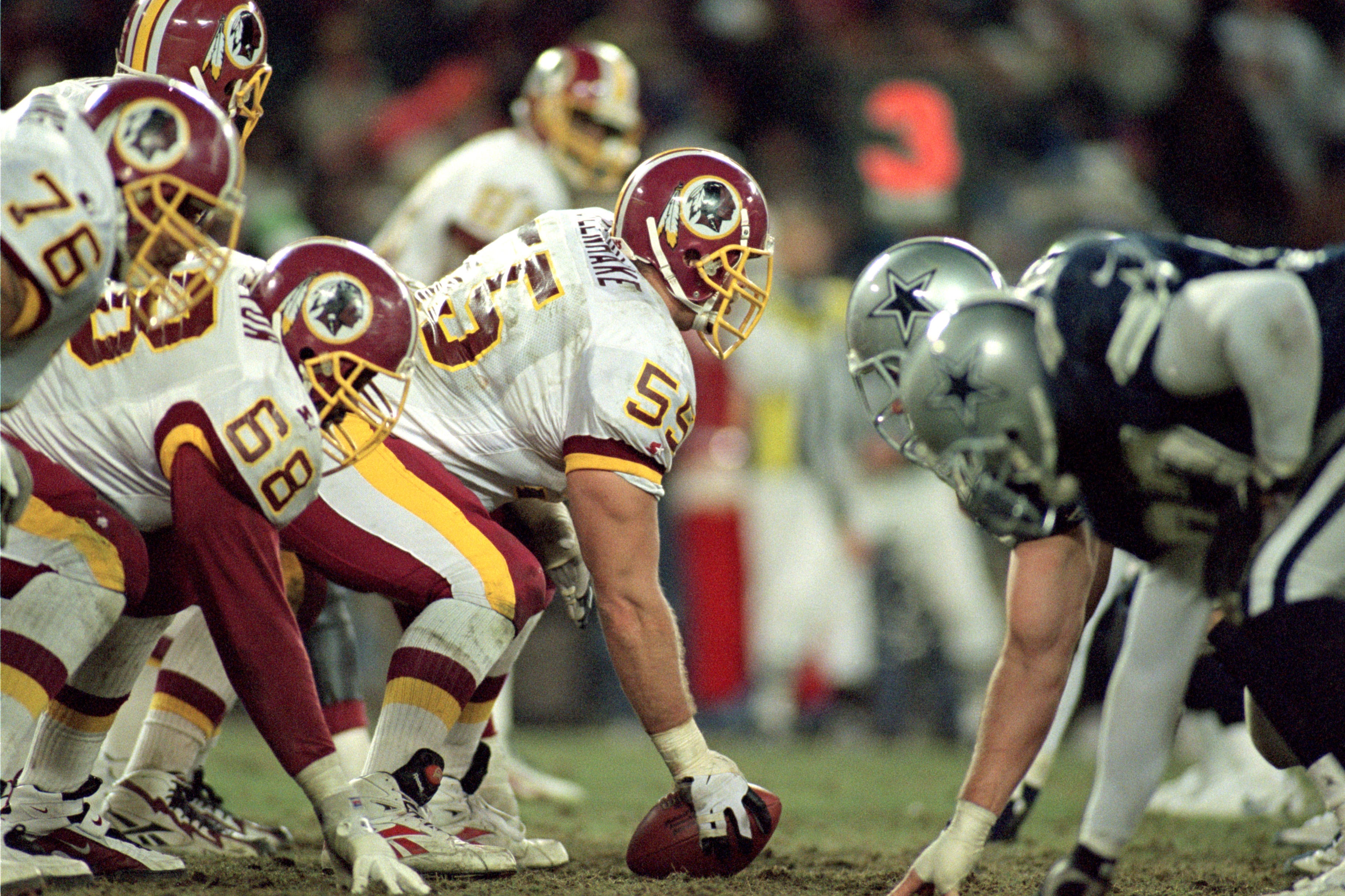 WASHINGTON - DECEMBER 22: Center Jeff Uhlenhake #55 of the Washington Redskins prepares to snap the ball against the Dallas Cowboys during the NFL game at RFK Stadium on December 22, 1996 in Washington, D.C. The Redskins defeated the Cowboys 37-7. (Photo by Doug Pensinger/Getty Images)