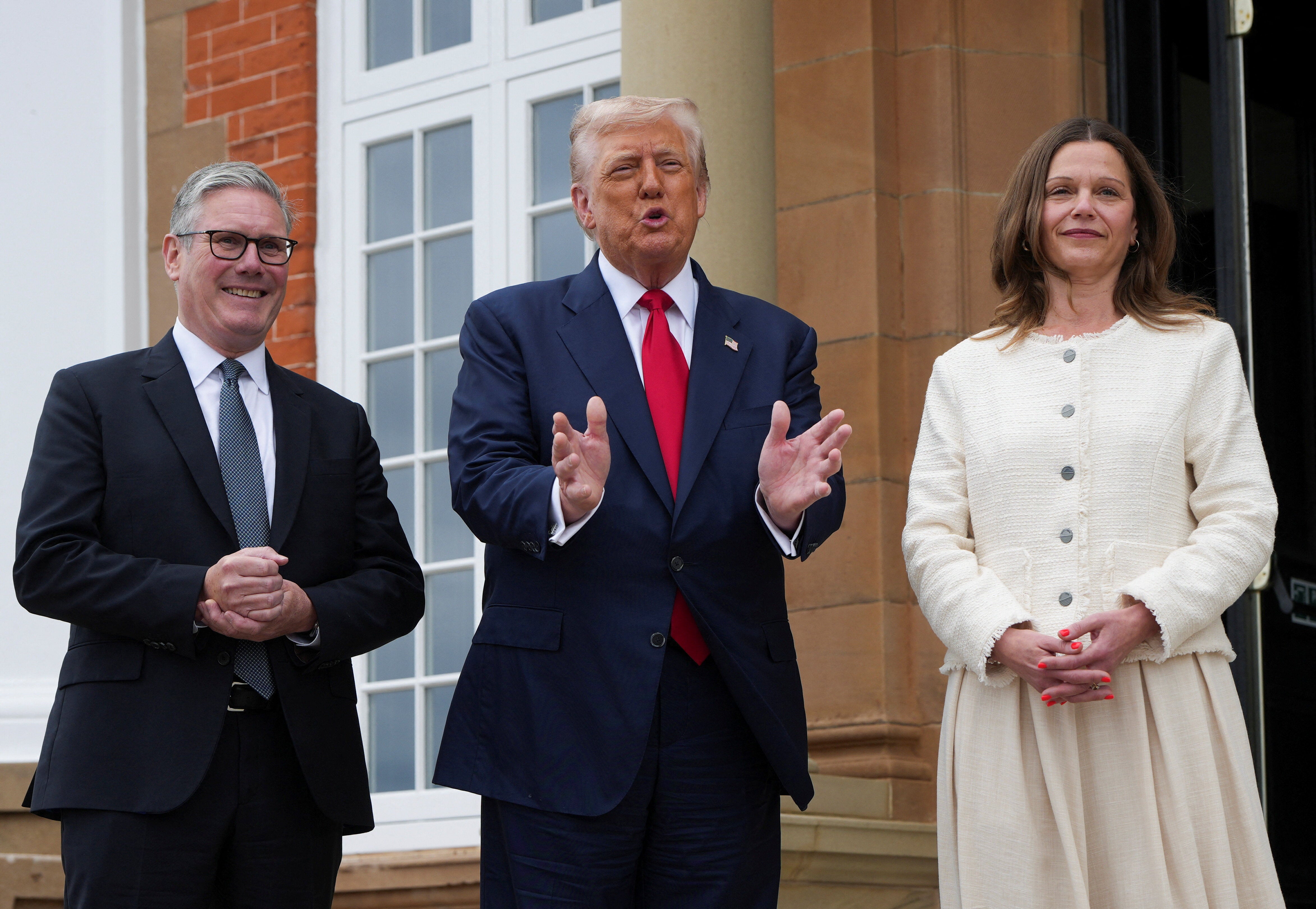 US president Donald Trump speaks with British prime minister Keir Starmer and his wife Victoria Starmer at Trump Turnberry golf club in Scotland in July